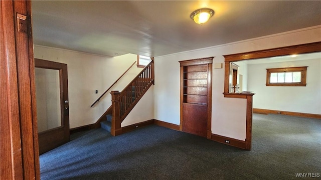 341 Dartmouth Ave, Buffalo, NY 14215 - unfurnished room featuring dark carpet, baseboards, stairs, and crown molding