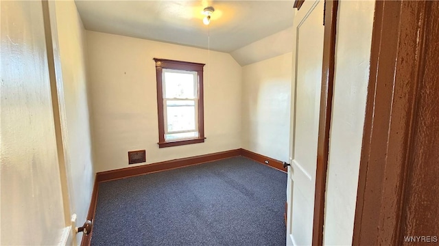 341 Dartmouth Ave, Buffalo, NY 14215 - spare room featuring carpet flooring, baseboards, and lofted ceiling