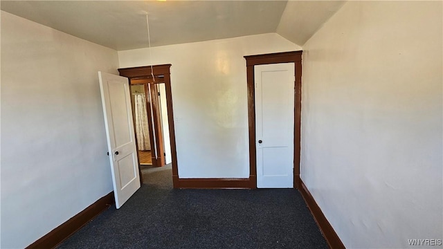 341 Dartmouth Ave, Buffalo, NY 14215 - unfurnished room with baseboards and lofted ceiling