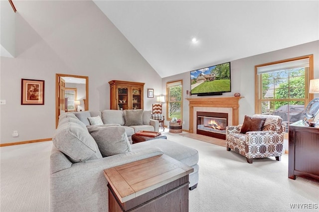 23 Gatehouse Ln, Amherst, NY 14051 - living room with light colored carpet, high vaulted ceiling, a fireplace with flush hearth, and baseboards