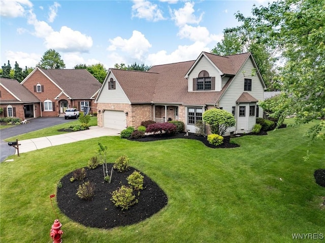 23 Gatehouse Ln, Amherst, NY 14051 - view of front of property with driveway, a front yard, brick siding, and a garage