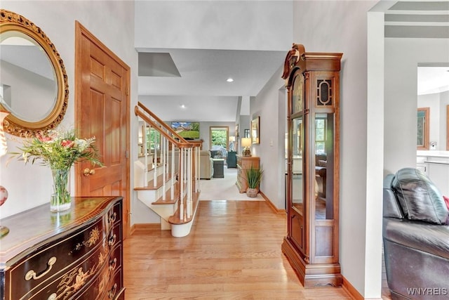 23 Gatehouse Ln, Amherst, NY 14051 - foyer with light wood finished floors, stairs, baseboards, and recessed lighting