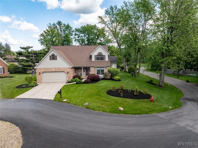 23 Gatehouse Ln, Amherst, NY 14051 - view of front facade with driveway, a front yard, and stone siding