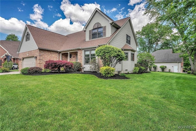 23 Gatehouse Ln, Amherst, NY 14051 - view of front of property featuring a front lawn, brick siding, and roof with shingles
