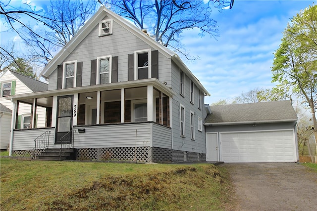 569 Washington Ave, Irondequoit, NY 14617 - traditional style home with asphalt driveway, a sunroom, entry steps, a front lawn, and an attached garage