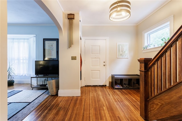 43 Woodland Park, Rochester, NY 14610 - foyer entrance with wood finished floors, arched walkways, baseboards, stairway, and ornamental molding