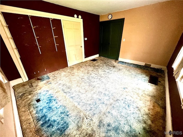 6723 Akron Rd, Lockport Town, NY 14094 - unfurnished bedroom with carpet floors, a closet, and baseboards