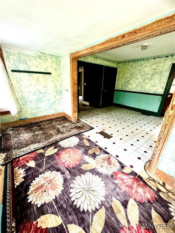 6723 Akron Rd, Lockport Town, NY 14094 - bathroom with tile patterned floors, baseboards, and wallpapered walls
