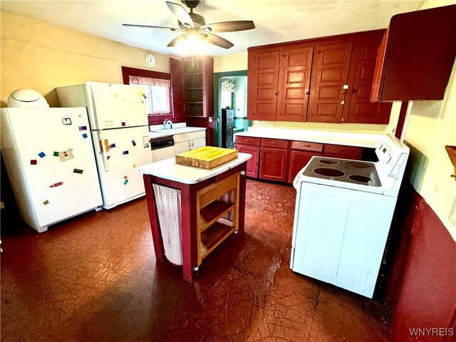 6723 Akron Rd, Lockport Town, NY 14094 - kitchen with white appliances, ceiling fan, light countertops, dark floors, and a sink
