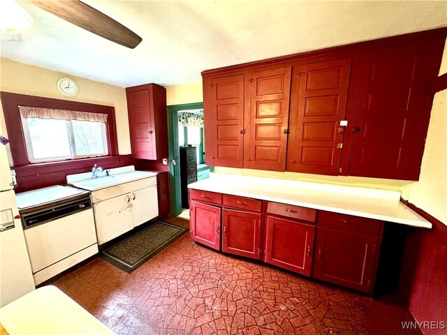 6723 Akron Rd, Lockport Town, NY 14094 - kitchen with white dishwasher, light countertops, reddish brown cabinets, and a sink