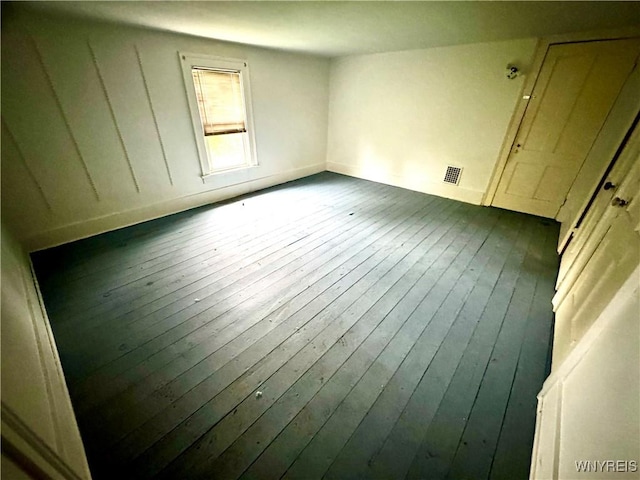 6723 Akron Rd, Lockport Town, NY 14094 - empty room with dark wood-type flooring and baseboards