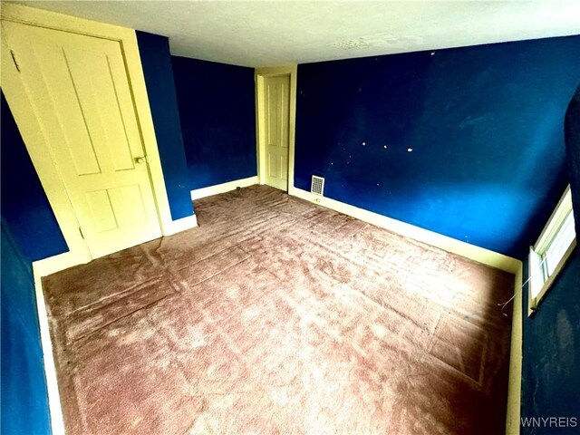 6723 Akron Rd, Lockport Town, NY 14094 - unfurnished room with baseboards and carpet flooring