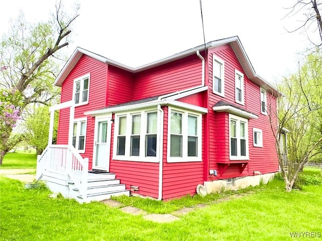 6723 Akron Rd, Lockport Town, NY 14094 - rear view of house with a lawn