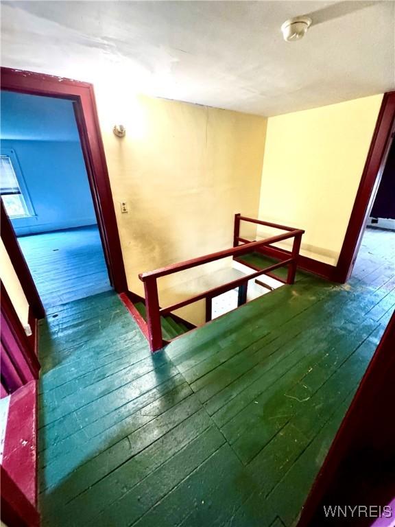 6723 Akron Rd, Lockport Town, NY 14094 - staircase featuring hardwood / wood-style floors and baseboards