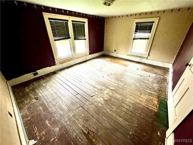 6723 Akron Rd, Lockport Town, NY 14094 - unfurnished room with wood-type flooring and baseboards