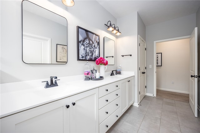8 Colten Ct, Penfield, NY 14580 - bathroom with double vanity, tile patterned flooring, and baseboards