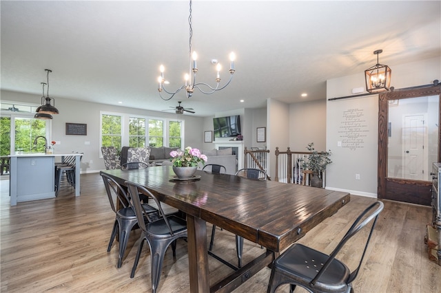 8 Colten Ct, Penfield, NY 14580 - dining area with a chandelier, light wood-type flooring, baseboards, recessed lighting, and ceiling fan