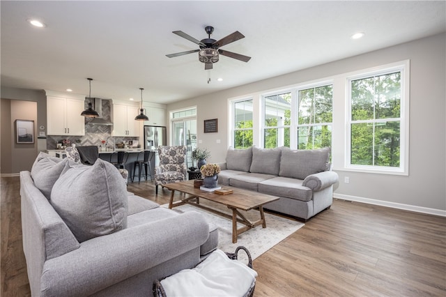 8 Colten Ct, Penfield, NY 14580 - living room with recessed lighting, ceiling fan, light wood-style floors, and baseboards