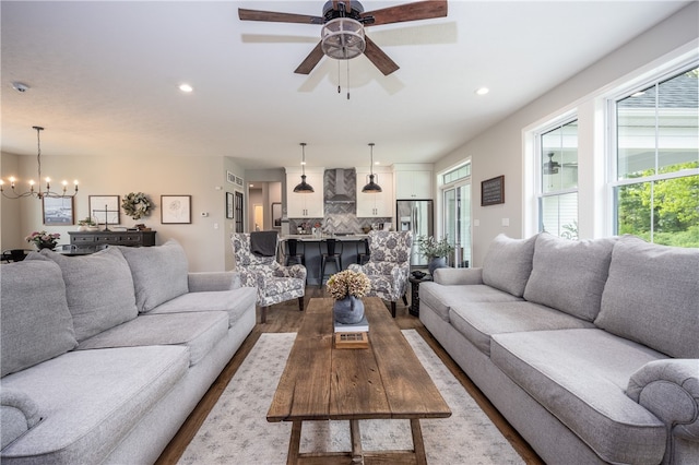 8 Colten Ct, Penfield, NY 14580 - living room with dark wood-style floors, a chandelier, recessed lighting, and ceiling fan
