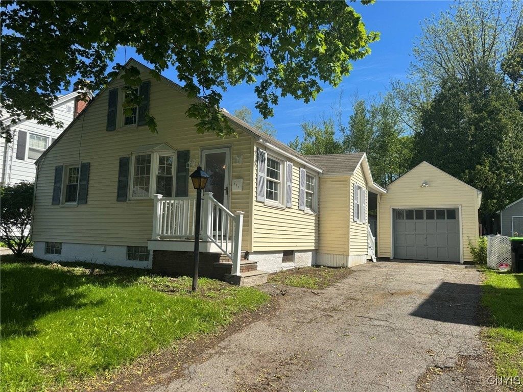 602 Pine Ave, Herkimer, NY 13350 - view of front of house with an outdoor structure, driveway, and a garage