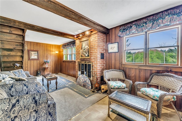 543 Middlefield Rd, Westford, NY 12155 - living room with beam ceiling, wooden walls, tile patterned floors, and a brick fireplace