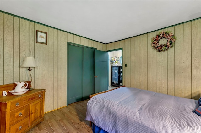 543 Middlefield Rd, Westford, NY 12155 - bedroom with a closet, wood finished floors, and wooden walls