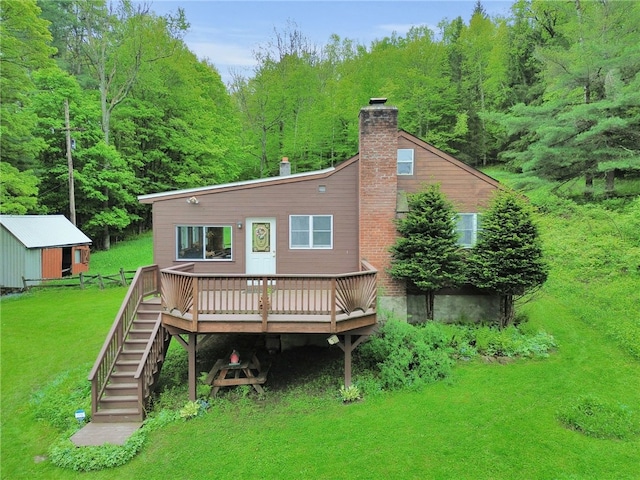 543 Middlefield Rd, Westford, NY 12155 - rear view of property featuring a wooden deck, stairs, a chimney, a lawn, and a view of trees