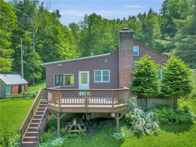 543 Middlefield Rd, Westford, NY 12155 - rear view of house featuring a wooden deck, a yard, a chimney, stairway, and a forest view
