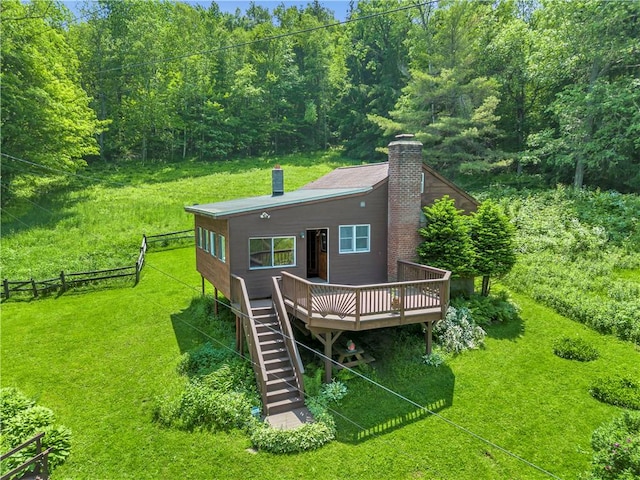 543 Middlefield Rd, Westford, NY 12155 - rear view of property with a chimney, a wooden deck, stairway, and a forest view