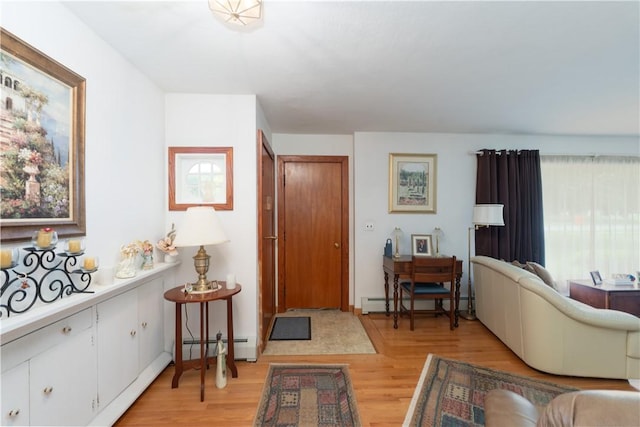9 N Clinton St, North Dansville, NY 14437 - entryway with light wood-type flooring, a baseboard radiator, and a baseboard heating unit