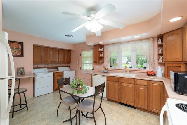 9 N Clinton St, North Dansville, NY 14437 - kitchen with washer / dryer, a sink, white appliances, and open shelves