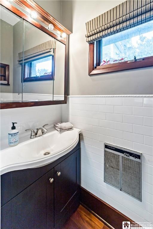 526 Central Ave, Dunkirk-City, NY 14048 - bathroom featuring vanity, wainscoting, and plenty of natural light