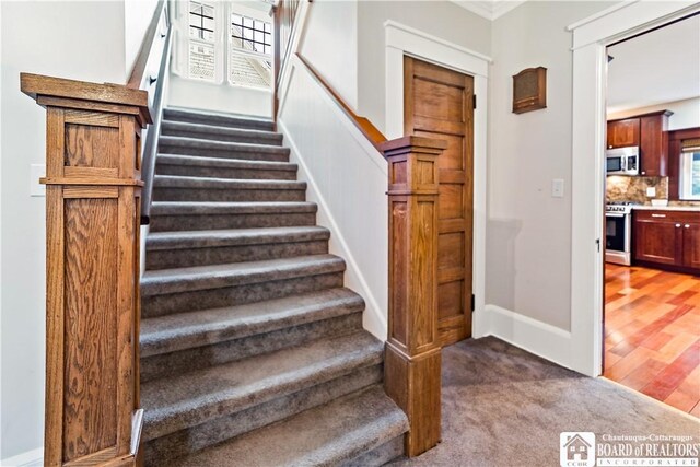 526 Central Ave, Dunkirk-City, NY 14048 - staircase with carpet, baseboards, and ornamental molding
