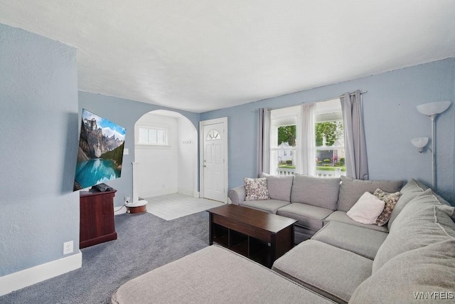 2902 Michigan Ave, Niagara Falls, NY 14305 - carpeted living room with arched walkways and baseboards