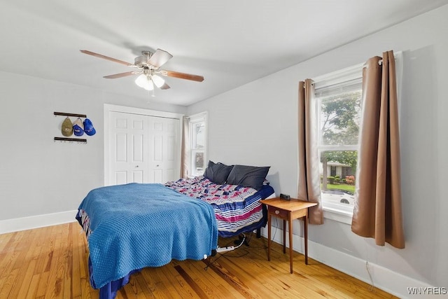 2902 Michigan Ave, Niagara Falls, NY 14305 - bedroom with baseboards, wood finished floors, a closet, and ceiling fan