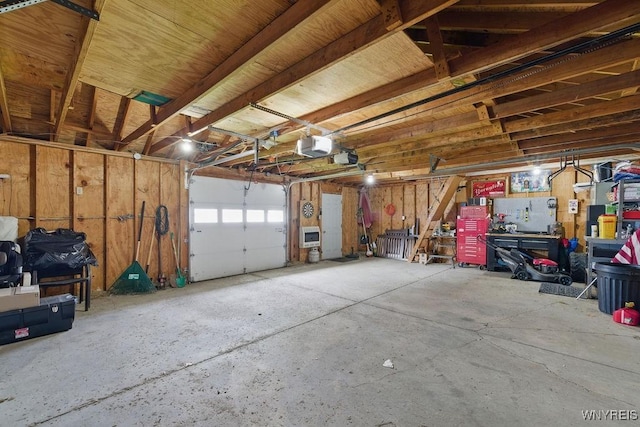 2902 Michigan Ave, Niagara Falls, NY 14305 - garage with a workshop area and a garage door opener