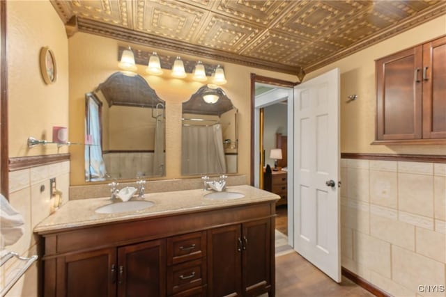 3374 State Route 49, Hastings, NY 13036 - bathroom featuring an ornate ceiling, tile walls, double vanity, crown molding, and wainscoting