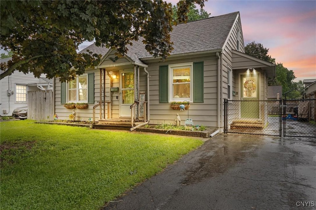 153 Everingham Rd, Onondaga, NY 13205 - view of front facade featuring a gate, a shingled roof, and driveway
