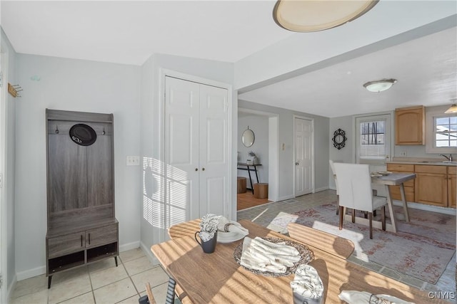 5435 Baldwin St, Cicero, NY 13029 - dining room with light tile patterned floors and baseboards