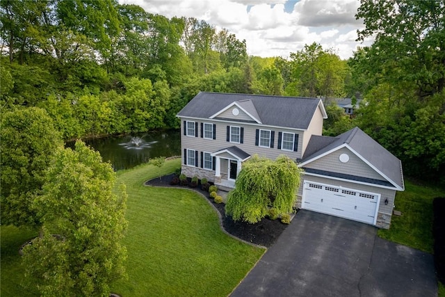 8 Kings Way, Chili, NY 14624 - colonial inspired home with stone siding, an attached garage, driveway, a front yard, and a water view