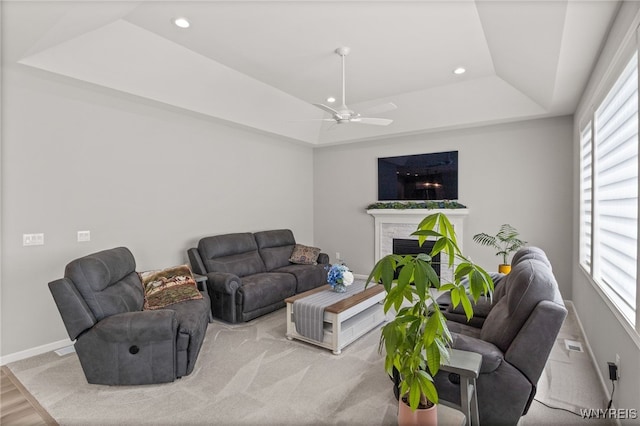 1167 Guinevere Dr, Greece, NY 14626 - living area with a raised ceiling, baseboards, a ceiling fan, recessed lighting, and a fireplace