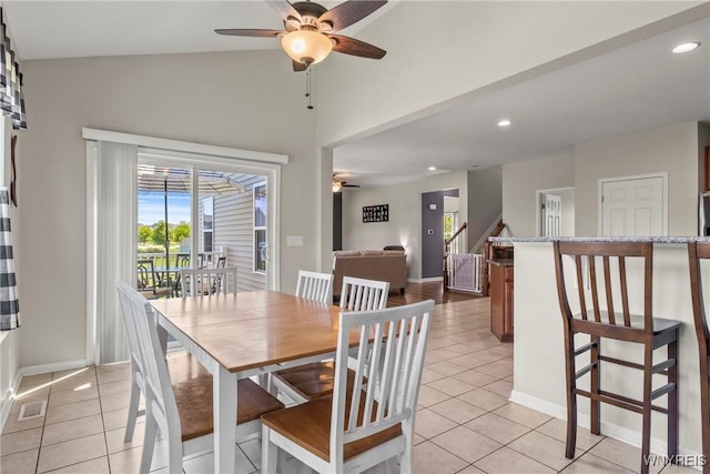52 Apple Blossom Blvd, Lancaster, NY 14086 - dining area featuring ceiling fan, light tile patterned floors, plenty of natural light, vaulted ceiling, and recessed lighting