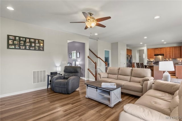 52 Apple Blossom Blvd, Lancaster, NY 14086 - living area featuring wood finished floors, ceiling fan, recessed lighting, stairs, and baseboards