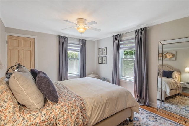1607 Stolp Ave, Syracuse, NY 13207 - bedroom with light wood-style floors, ceiling fan, crown molding, and baseboards