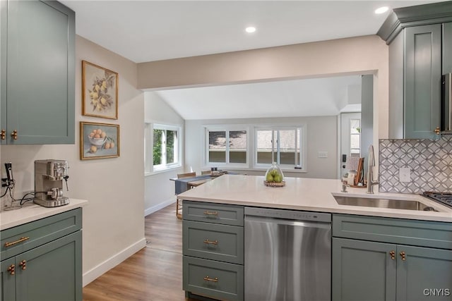 1607 Stolp Ave, Syracuse, NY 13207 - kitchen with dishwasher, a sink, green cabinetry, backsplash, and light countertops