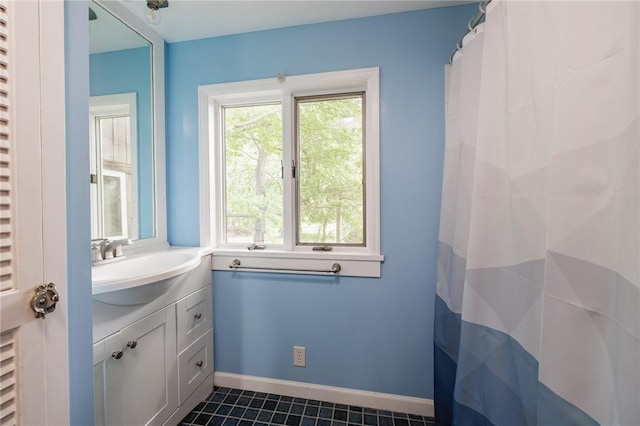 6695 Fisher Rd, Ontario, NY 14589 - full bathroom featuring vanity, tile patterned flooring, and baseboards