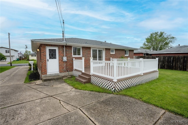 4314 Elmwood Ave, Hamburg, NY 14219 - back of property with brick siding, a wooden deck, and roof with shingles