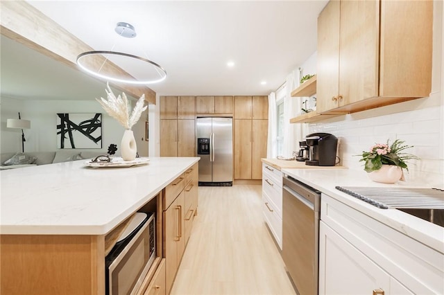 182 Stony Point Trl, Webster, NY 14580 - kitchen with stainless steel appliances, open shelves, light wood finished floors, a center island, and tasteful backsplash