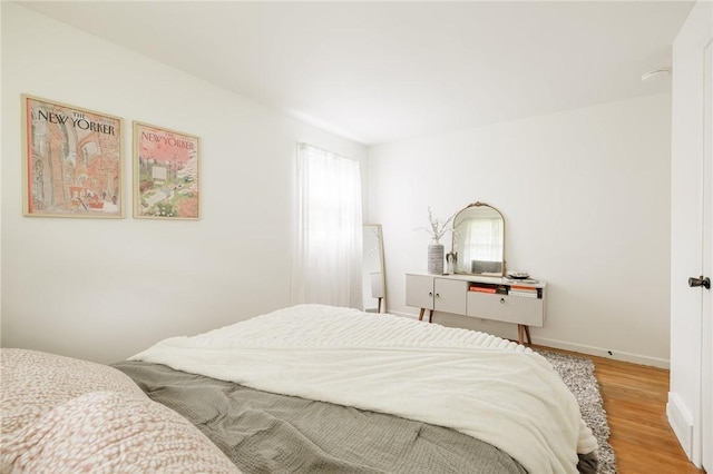 182 Stony Point Trl, Webster, NY 14580 - bedroom with multiple windows, light wood-style flooring, and baseboards