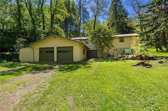 182 Stony Point Trl, Webster, NY 14580 - view of front of property featuring dirt driveway, a garage, and a front yard